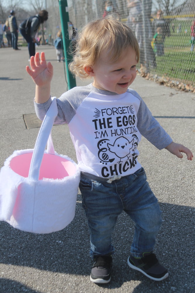 A youngster collects candy at the Riverside Area Community Club Easter at a past egg hunt.